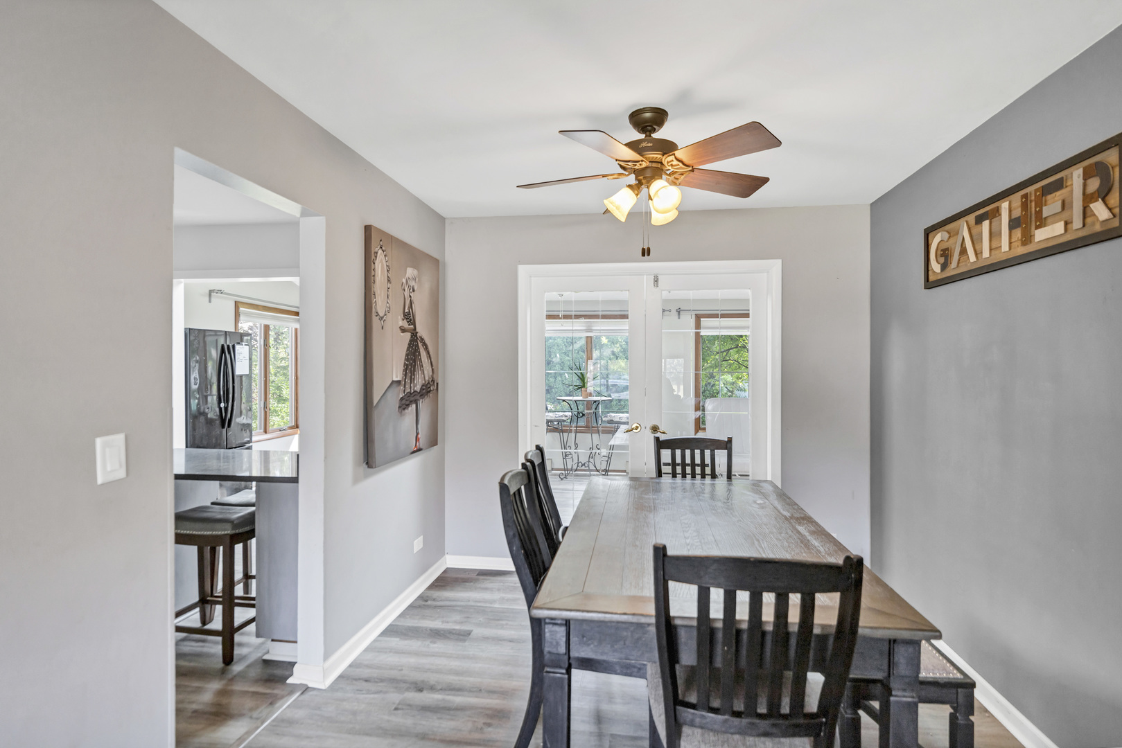 2315 Stepstone Lane Hanover Park, IL 60133 - Photo 11 of 30 a view of a dining room with furniture window and wooden floor