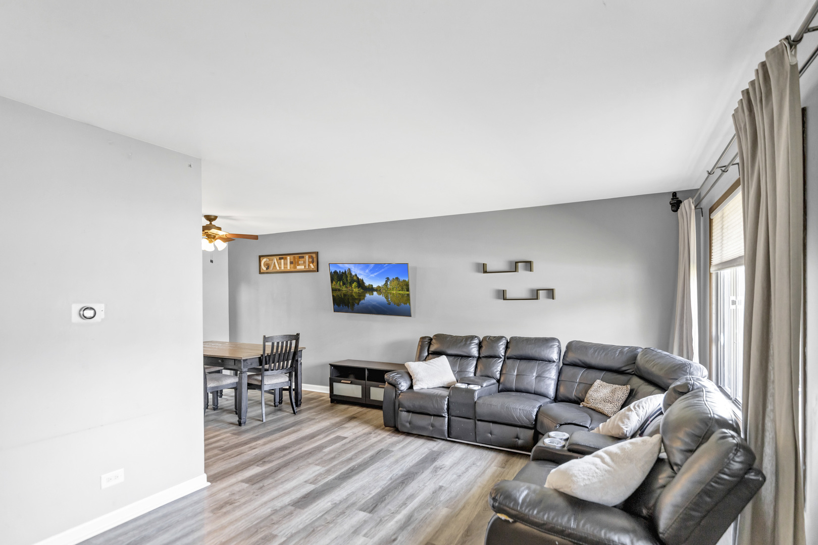 2315 Stepstone Lane Hanover Park, IL 60133 - Photo 12 of 30 a living room with furniture and a flat screen tv