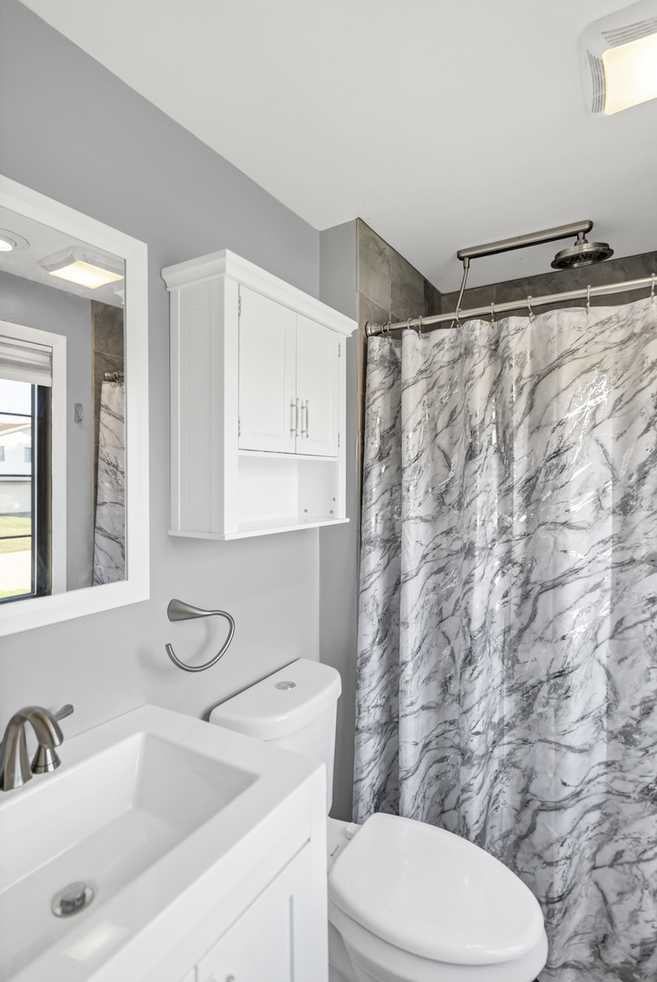 2315 Stepstone Lane Hanover Park, IL 60133 - Photo 15 of 30 a bathroom with a sink and a toilet
