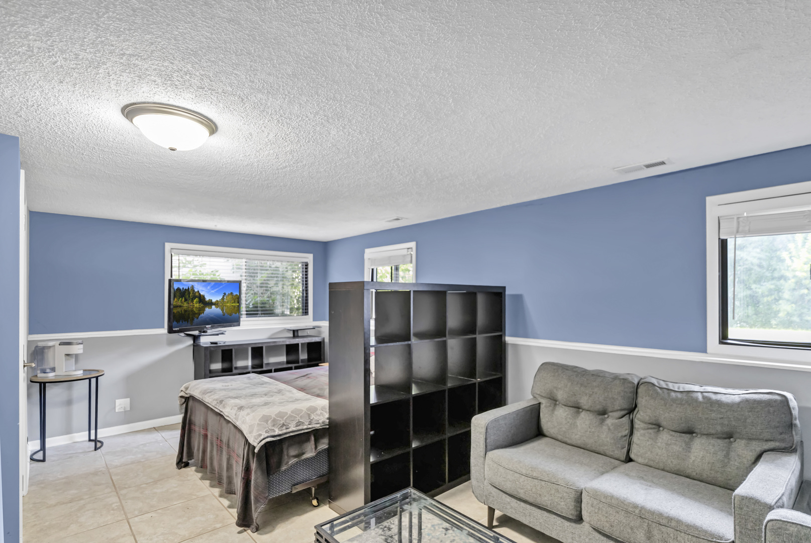 2315 Stepstone Lane Hanover Park, IL 60133 - Photo 23 of 30 a living room with furniture a refrigerator and a window