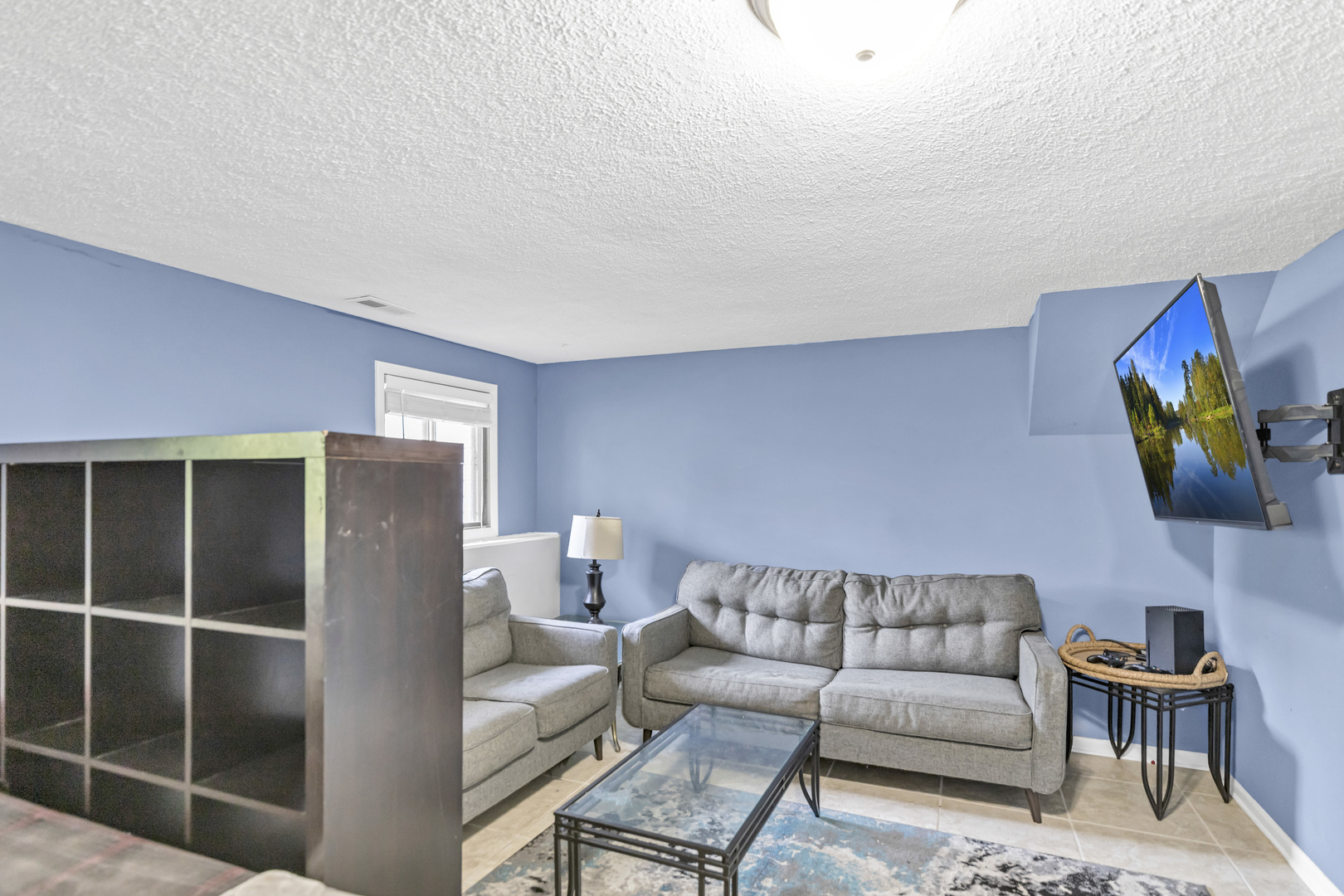 2315 Stepstone Lane Hanover Park, IL 60133 - Photo 24 of 30 a living room with furniture a rug and a lamp