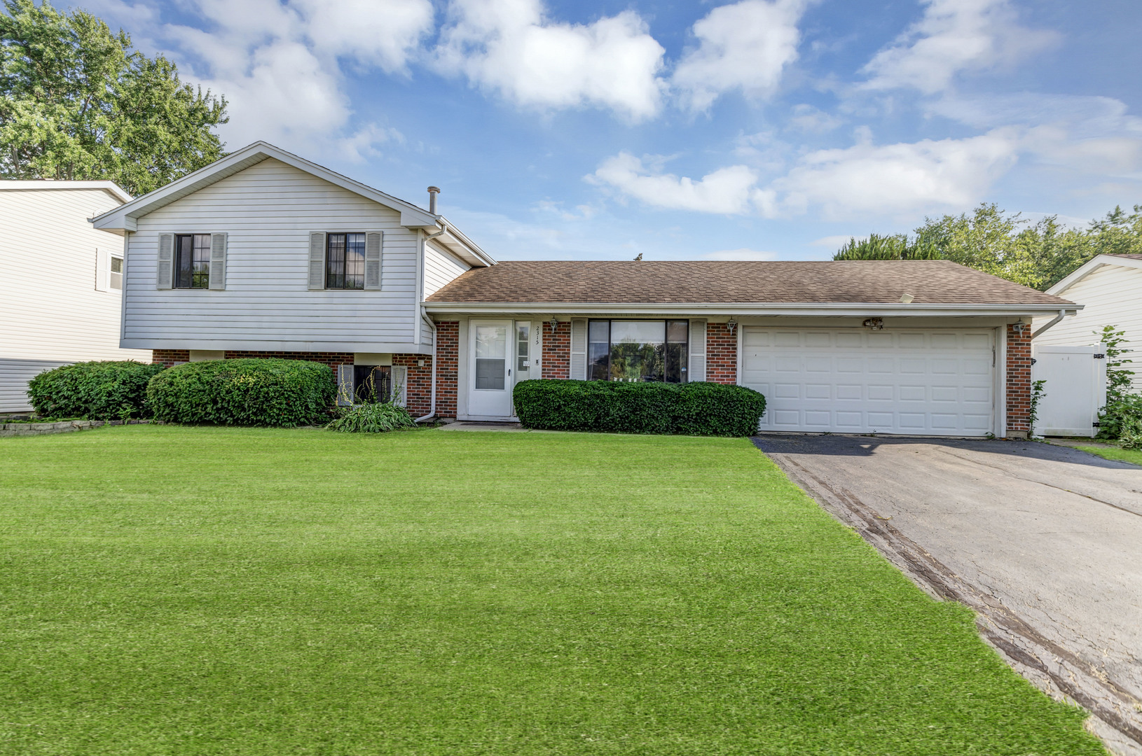 2315 Stepstone Lane Hanover Park, IL 60133 - Photo 30 of 30 a front view of a house with a garden