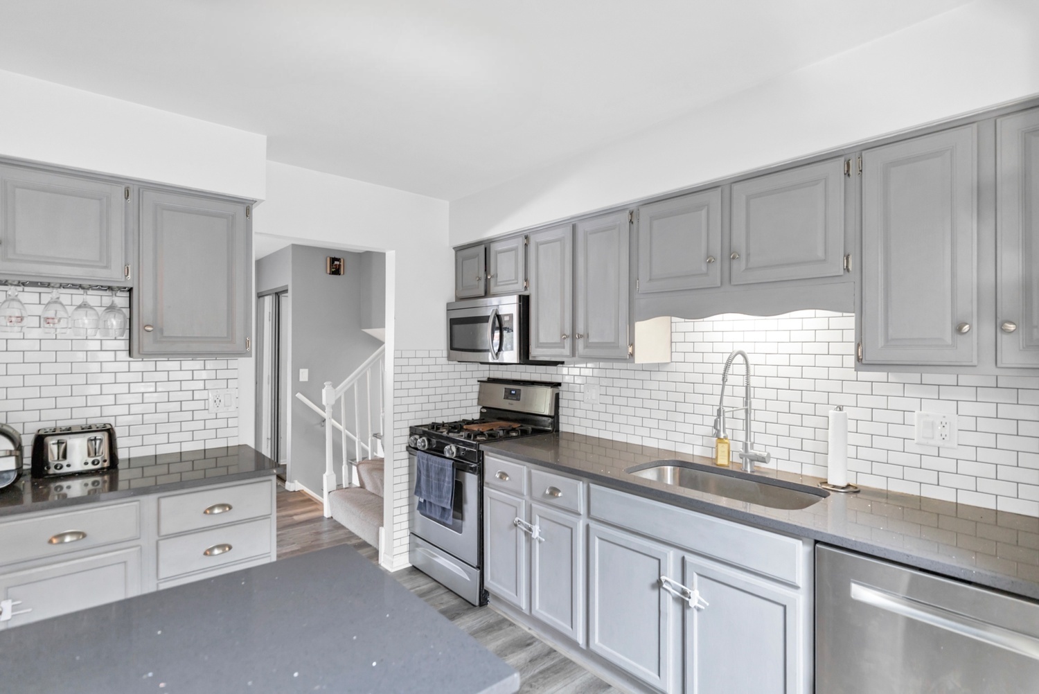 2315 Stepstone Lane Hanover Park, IL 60133 - Photo 5 of 30 a kitchen with granite countertop a sink stove and refrigerator