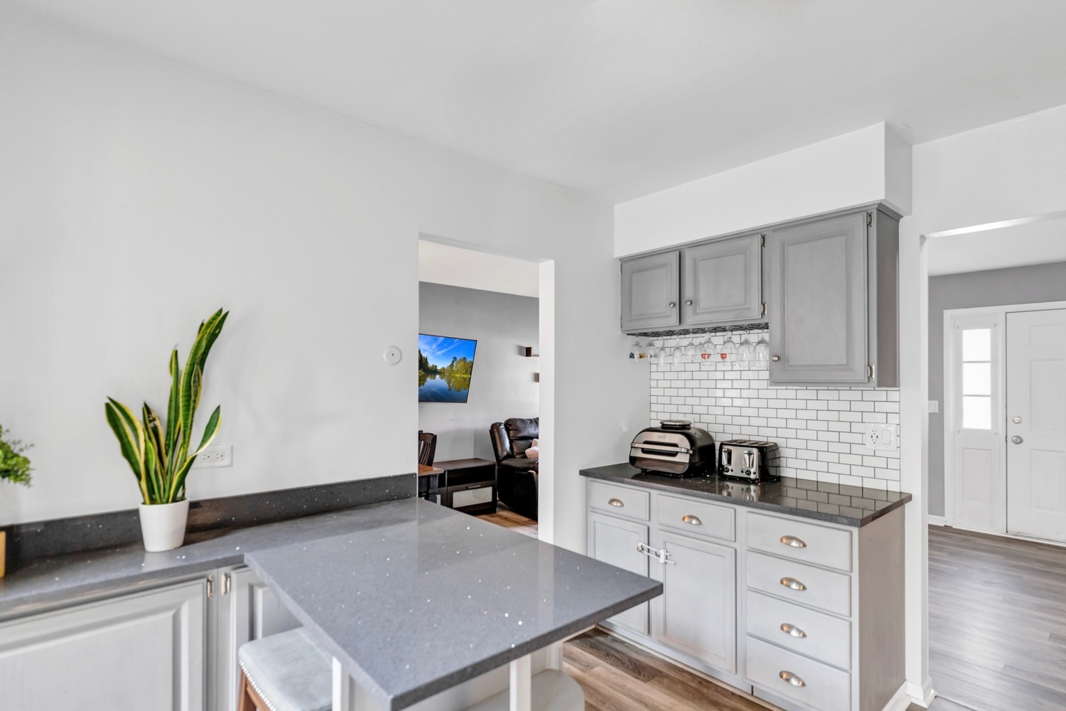 2315 Stepstone Lane Hanover Park, IL 60133 - Photo 6 of 30 a kitchen with stainless steel appliances a stove a refrigerator a sink a stove with wooden floor