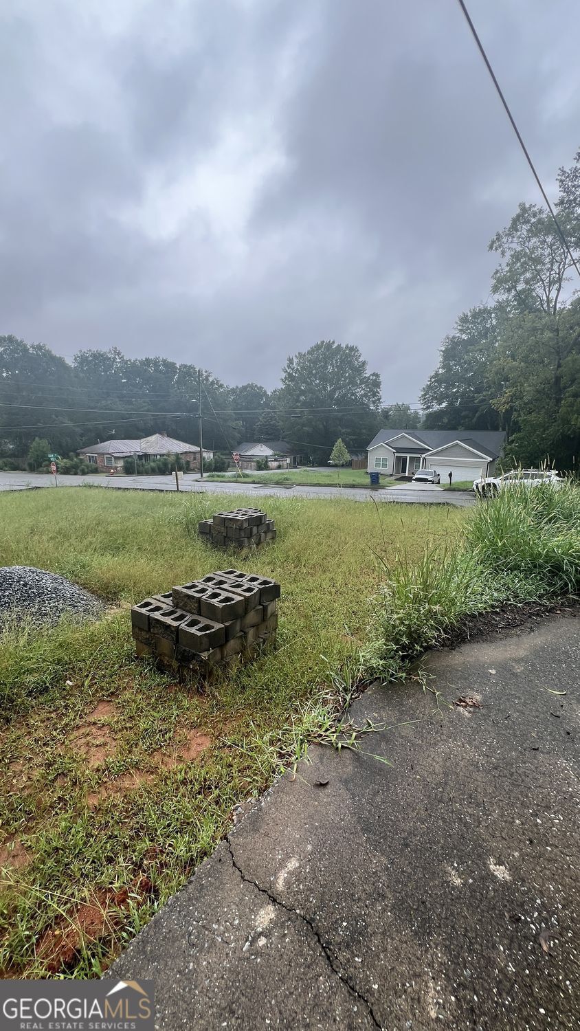 184 Capitol Avenue Winder, GA 30680 - Photo 6 of 7 a view of a lake with houses in the back