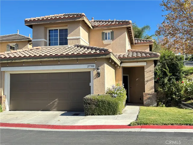 a front view of a house with a garage