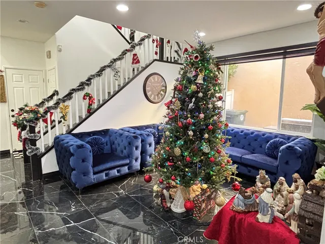 a living room filled with furniture and flowers