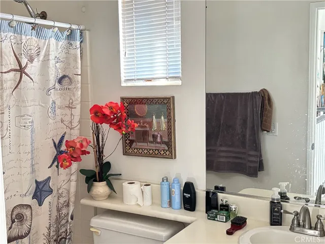 a bathroom with a bathtub a sink and a shower
