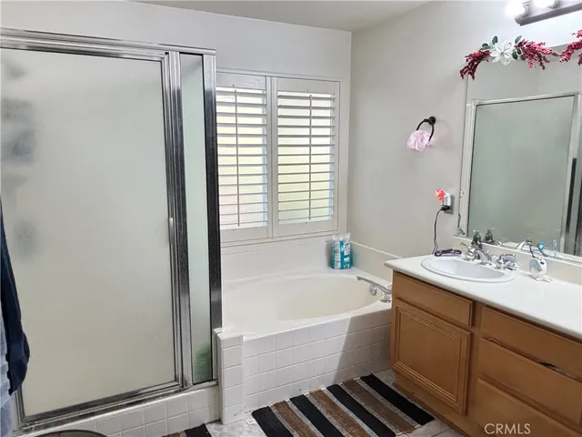 a bedroom with a bed and a television