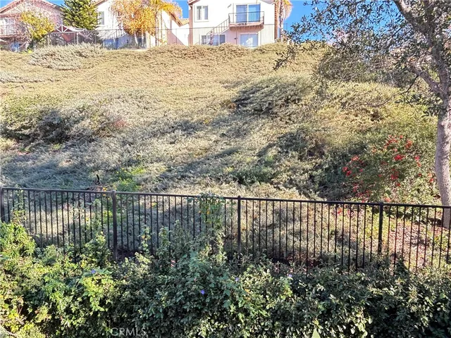 a room with lots of flowers and a chandelier