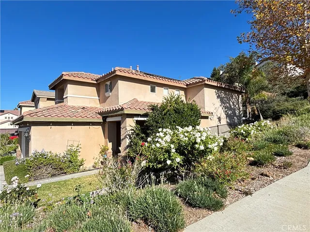 a view of a house with a small yard
