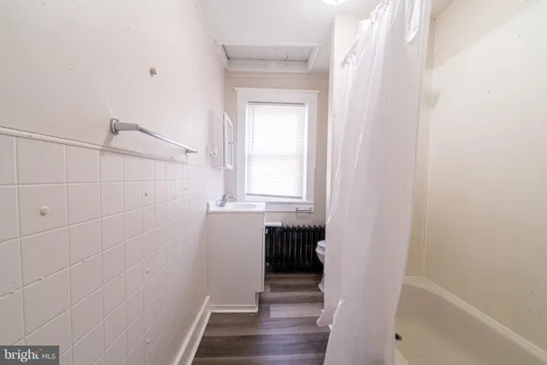 a bathroom with a sink and a window