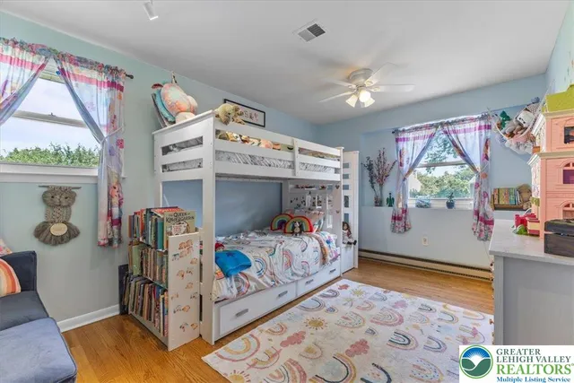 a bedroom with furniture and a window