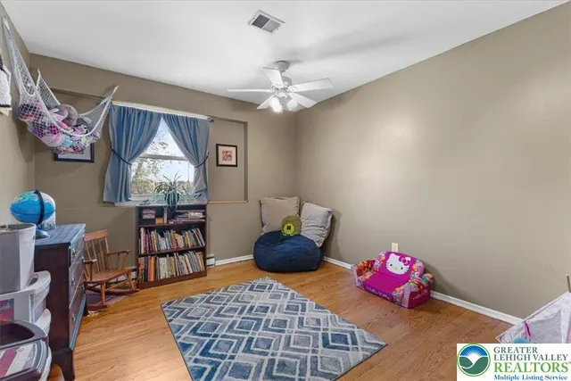 a bedroom with furniture and a chandelier
