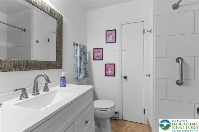a bathroom with a sink toilet and vanity