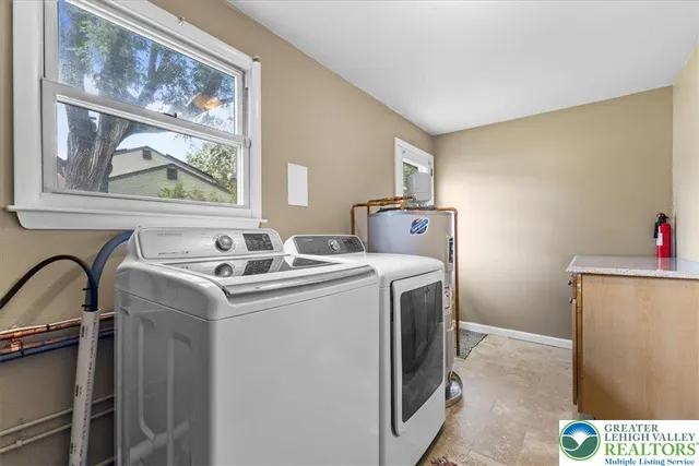 a utility room with dryer and washer
