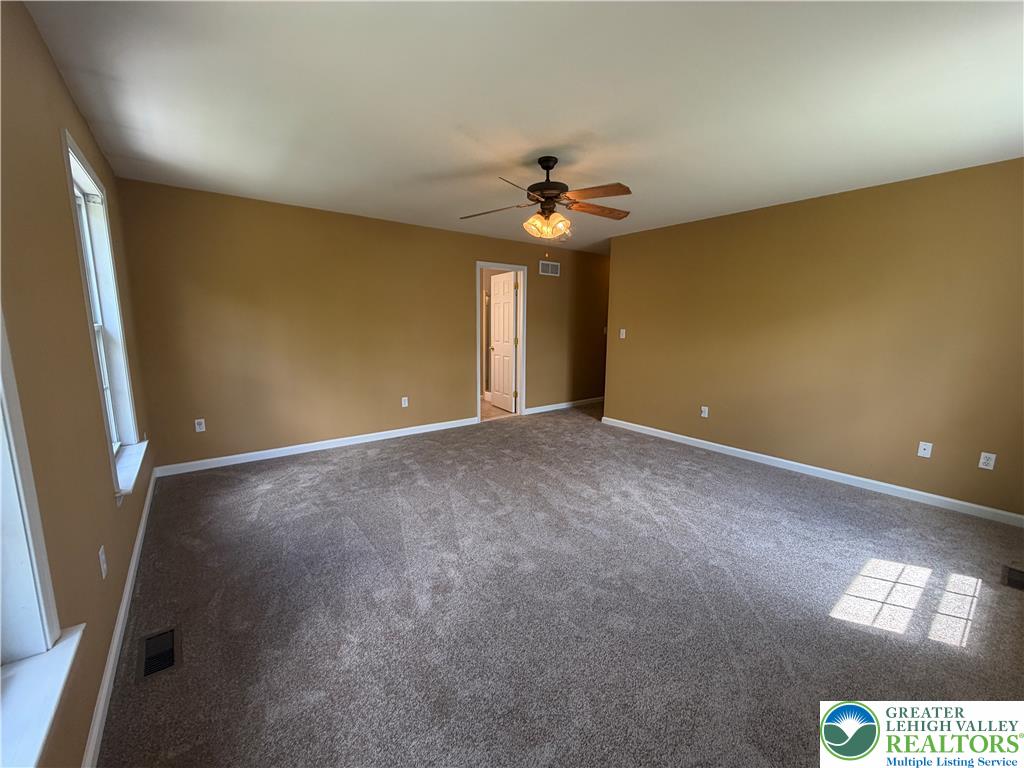 4157 Walter Road Bethlehem, PA 18020 - Photo 21 of 36 A spacious room offers comfortable carpeting, perfect for relaxation and everyday living.