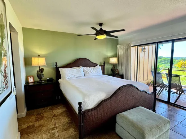 a bedroom with a bed dresser and a window