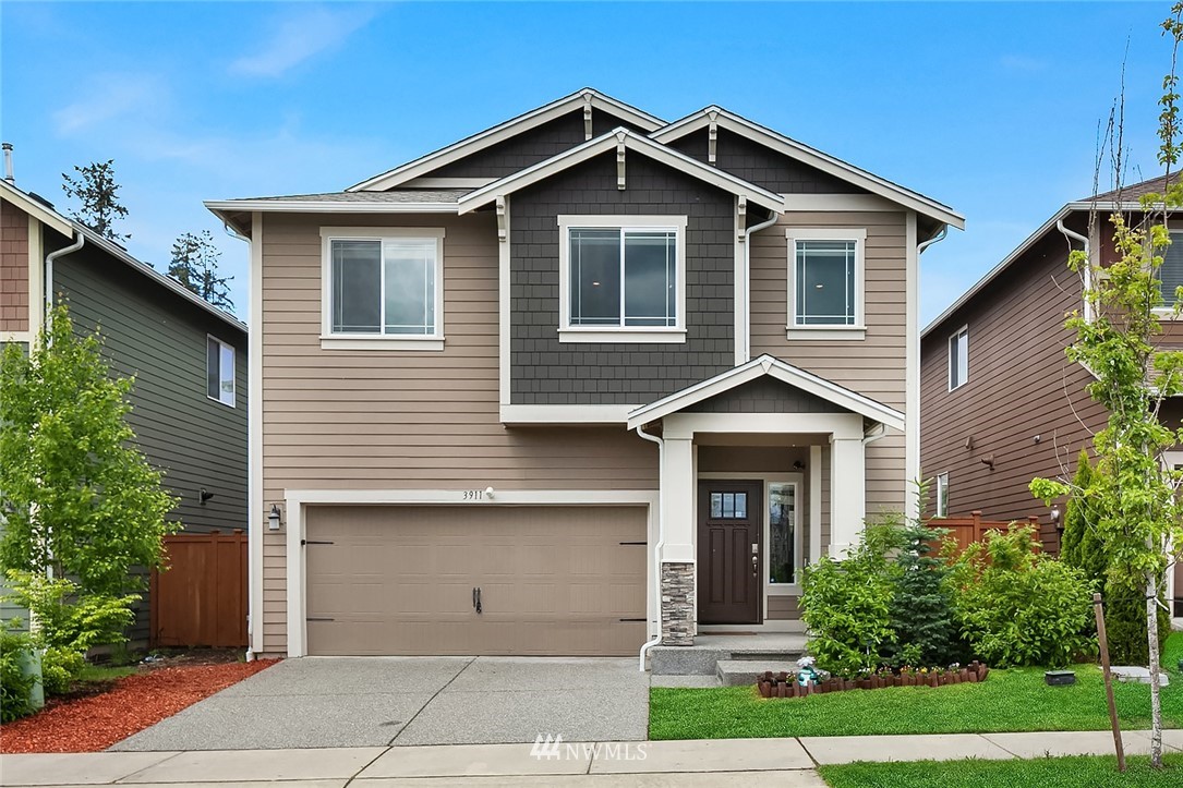 3911 174th Place Southeast Bothell, WA 98012 - Photo 1 of 27 a front view of a house with garden