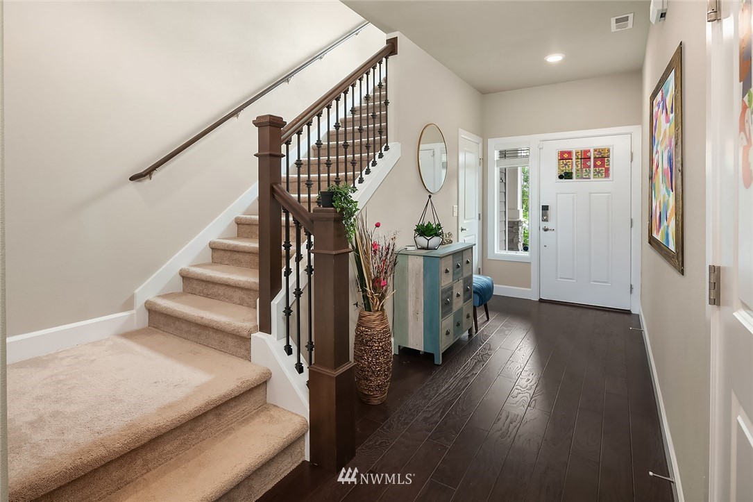 3911 174th Place Southeast Bothell, WA 98012 - Photo 4 of 27 a view of entryway and hall with wooden floor
