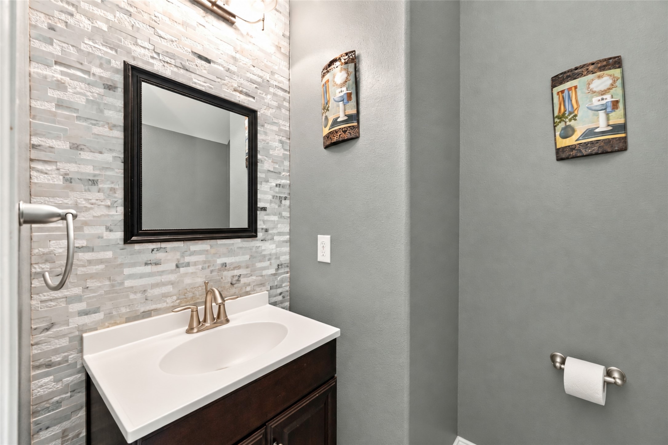 8338 Rudy Brook Way Spring, TX 77379 - Photo 25 of 33 A stylish half bath provides added convenience for guests downstairs.