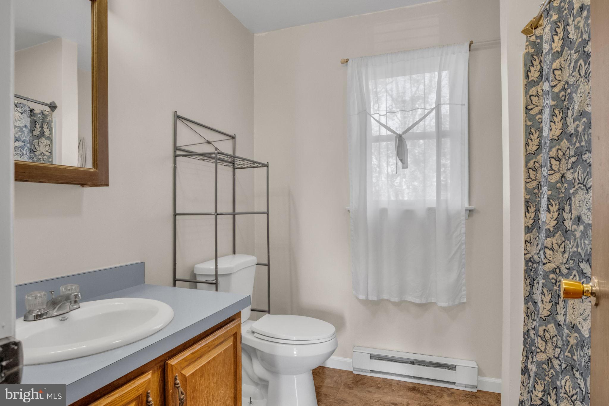 224 Faith Circle Carlisle, PA 17013 - Photo 17 of 32 a bathroom with a granite countertop sink toilet and shower