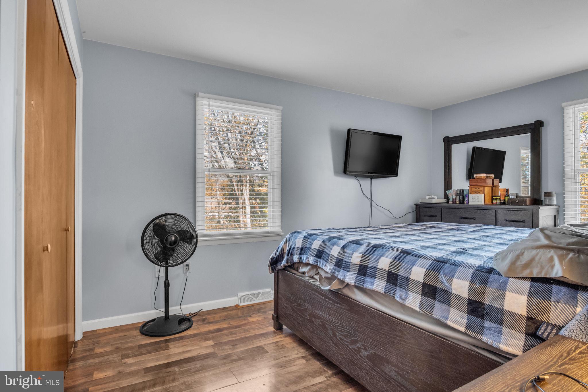 224 Faith Circle Carlisle, PA 17013 - Photo 18 of 32 a bedroom with a bed and a flat screen tv