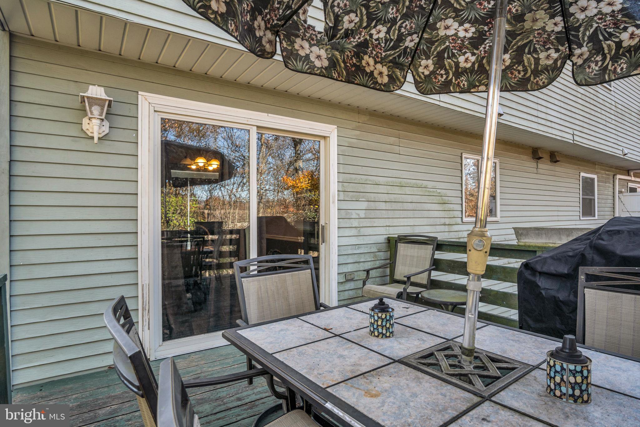 224 Faith Circle Carlisle, PA 17013 - Photo 29 of 32 a view of a patio with table and chairs and potted plants