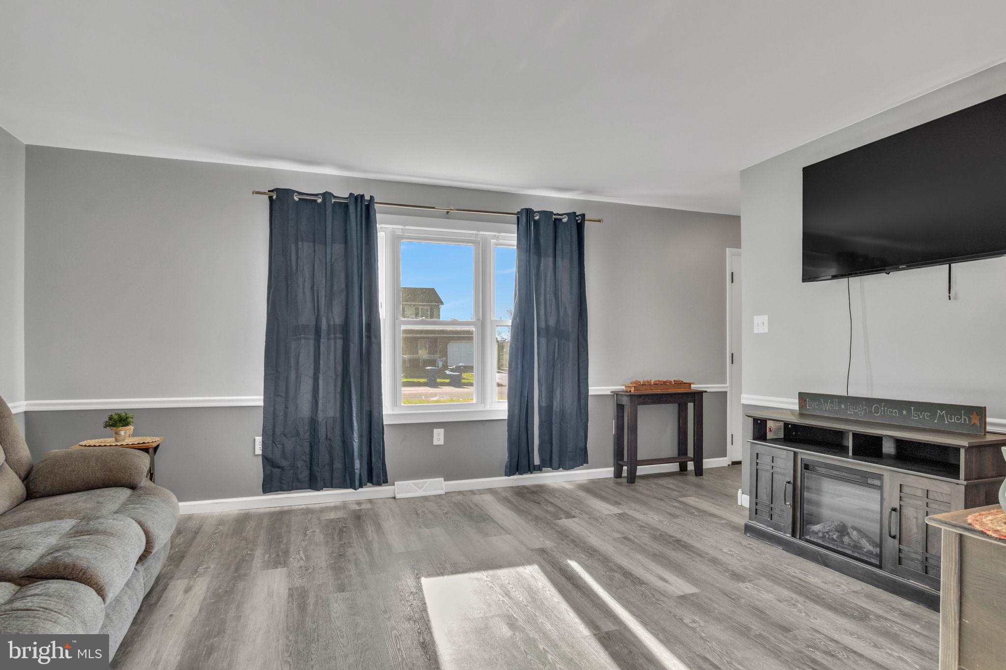 224 Faith Circle Carlisle, PA 17013 - Photo 4 of 32 a living room with furniture and a flat screen tv