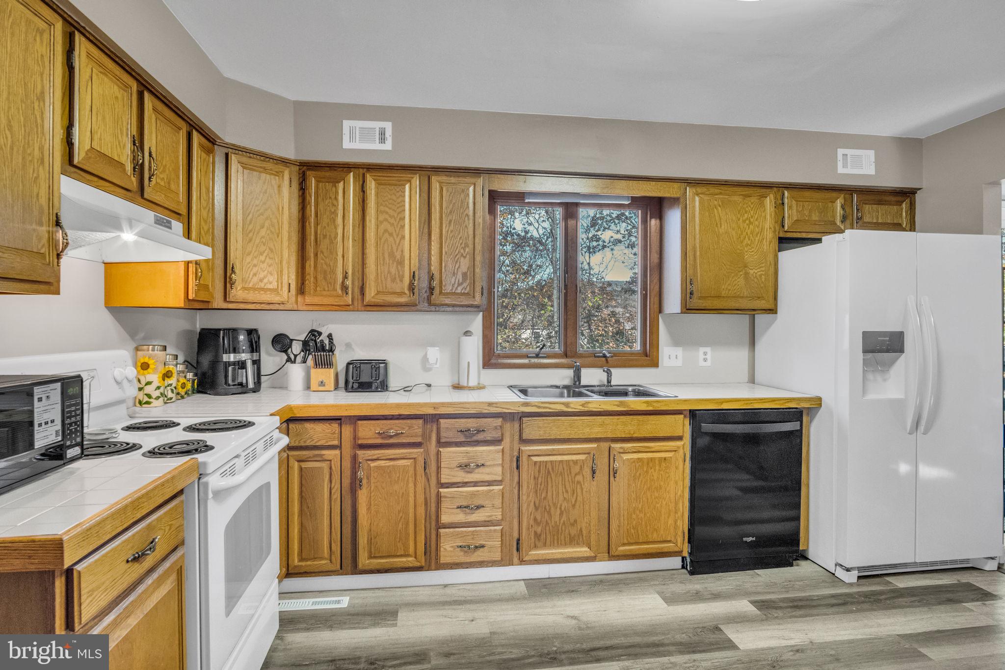 224 Faith Circle Carlisle, PA 17013 - Photo 8 of 32 a kitchen with stainless steel appliances granite countertop a stove and a sink
