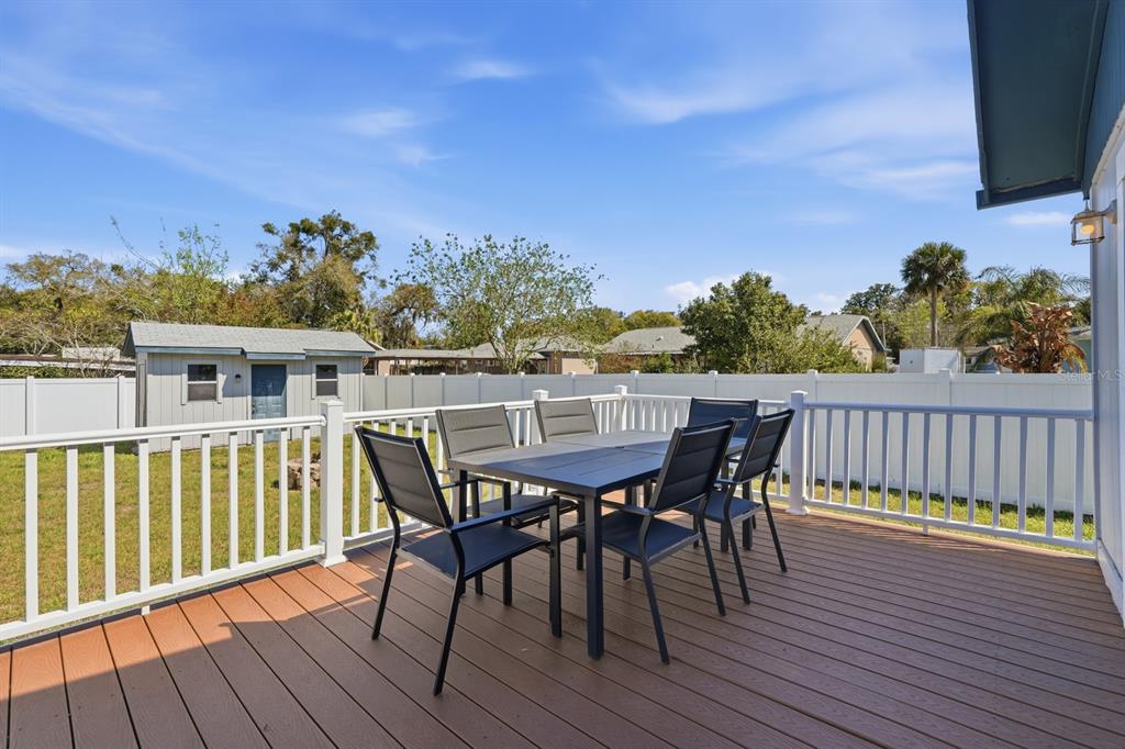 231 North Ridgewood Avenue Ormond Beach, FL 32174 - Photo 29 of 52 a view of a deck patio and outdoor seating
