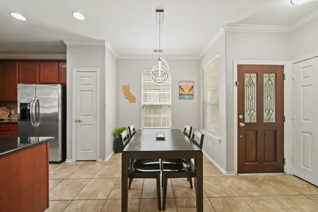 a view of a dining room kitchen and a window