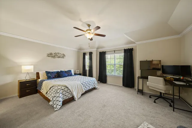 a bedroom with a bed and a couch