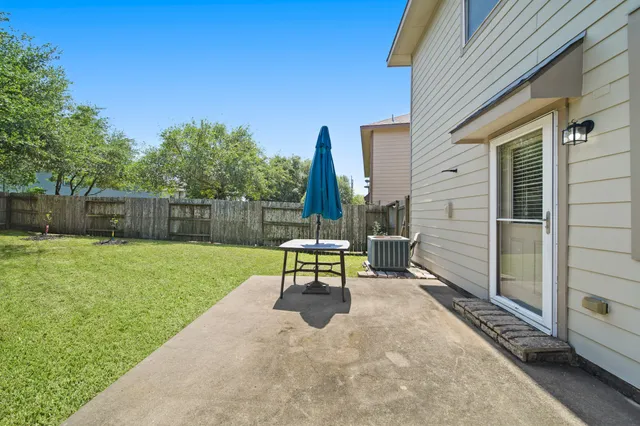 a backyard of a house with seating space