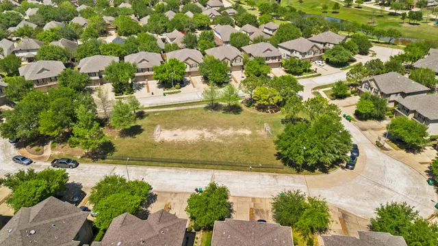 a view of a swimming pool with a table and chairs