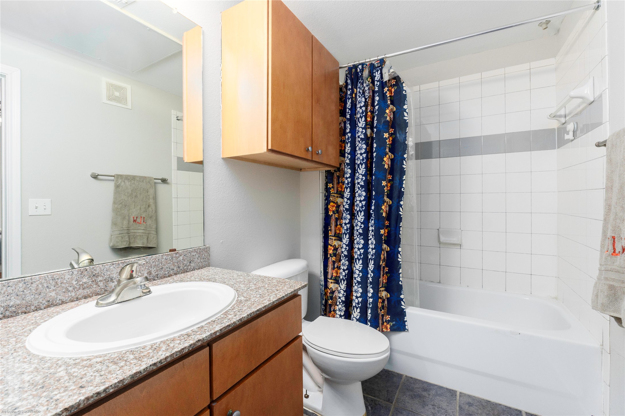 2502 Leon Street, Unit 305 Austin, TX 78705 - Photo 15 of 26 Full bathroom with vanity, shower / bathtub combination with curtain, and tile patterned floors