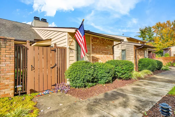 a view of front door and small yard