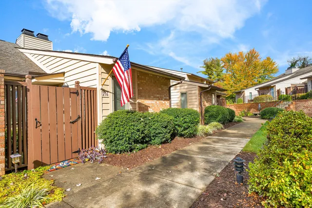 a view of a house with a small yard