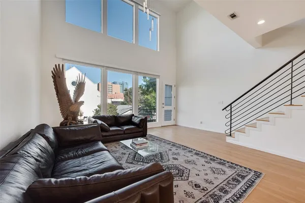 a living room with furniture and a rug