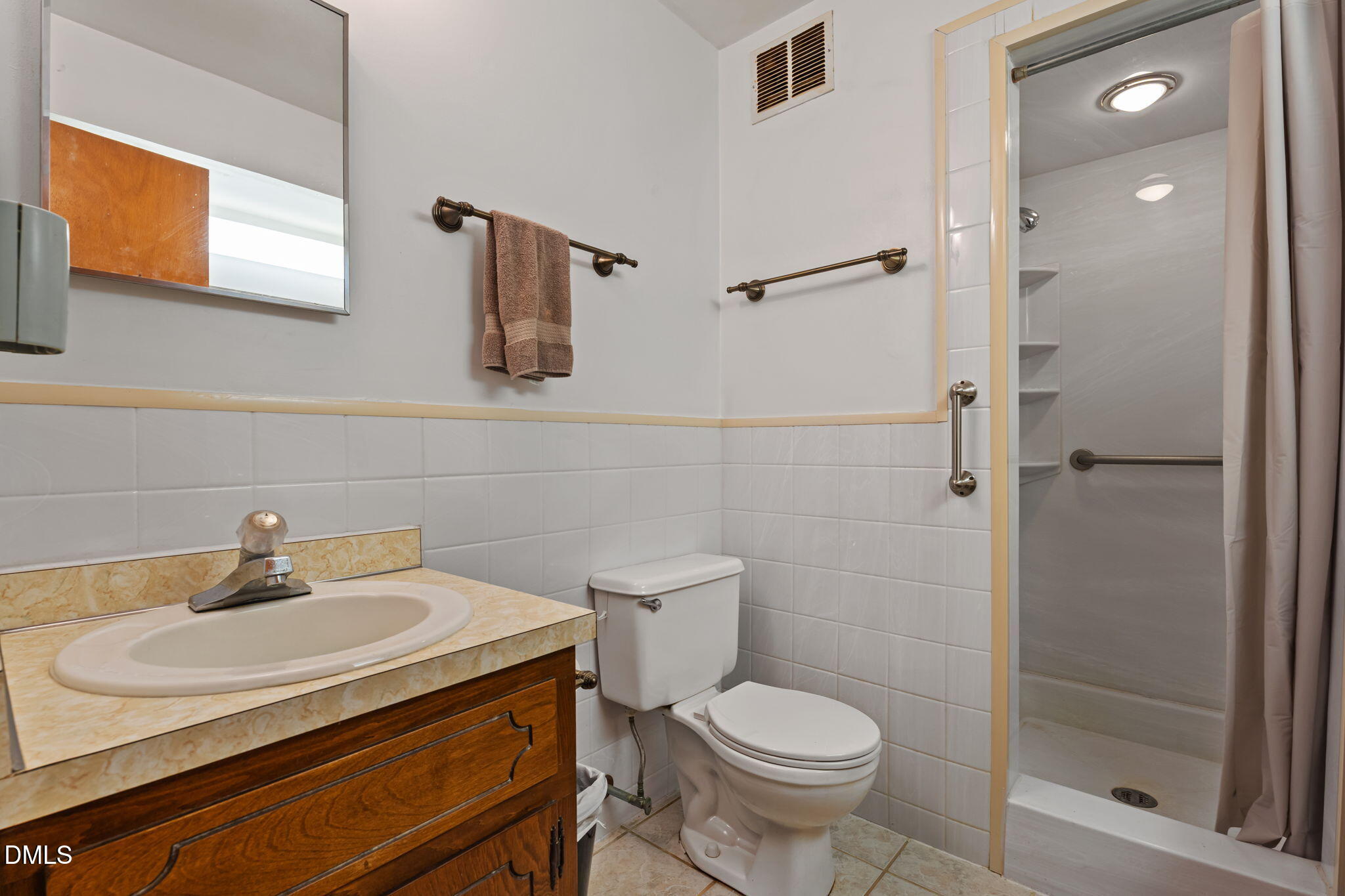 6409 Arrington Road Raleigh, NC 27607 - Photo 26 of 39 a bathroom with a sink toilet and shower