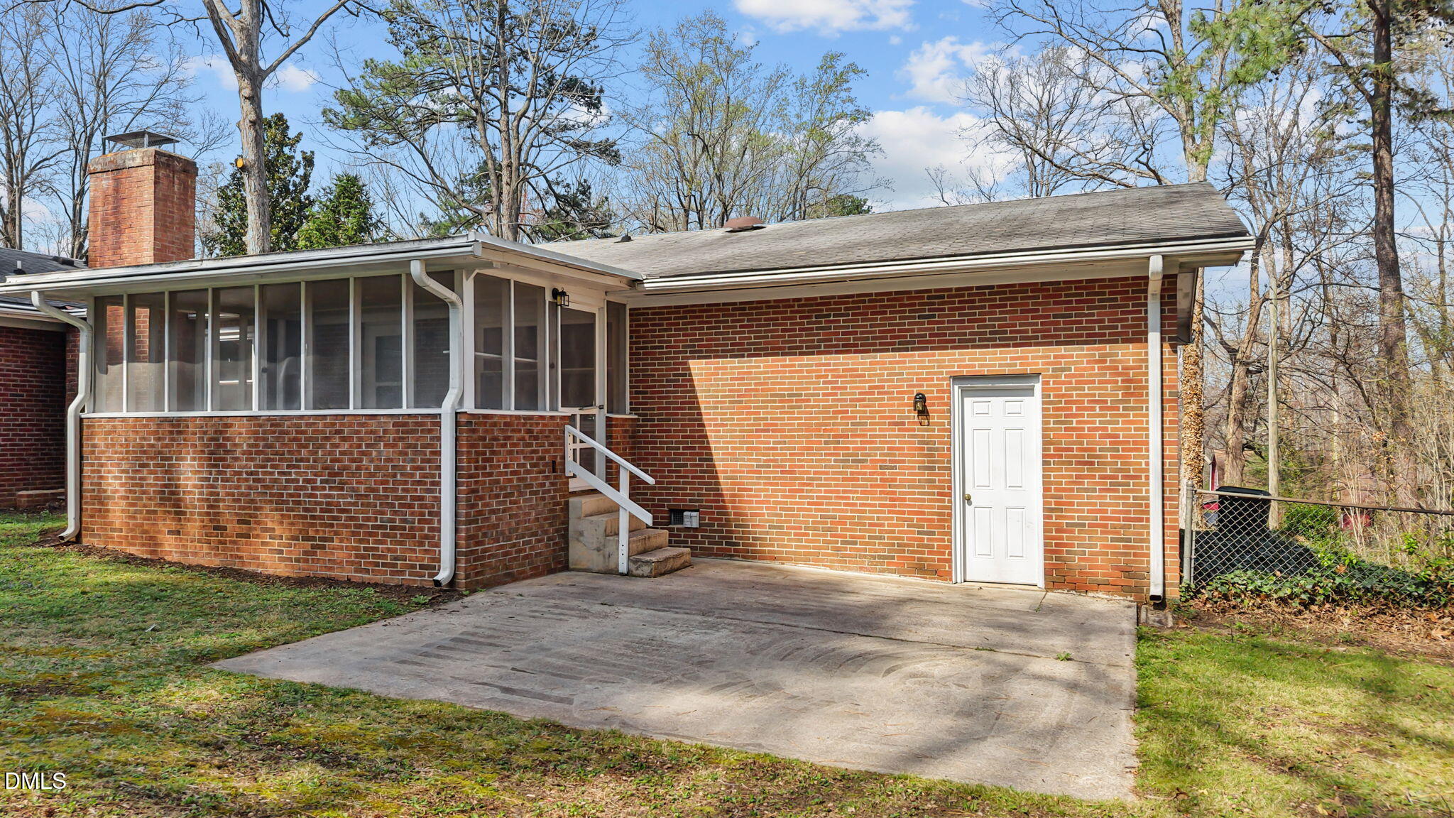 6409 Arrington Road Raleigh, NC 27607 - Photo 34 of 39 a view of a house with a small yard and wooden fence