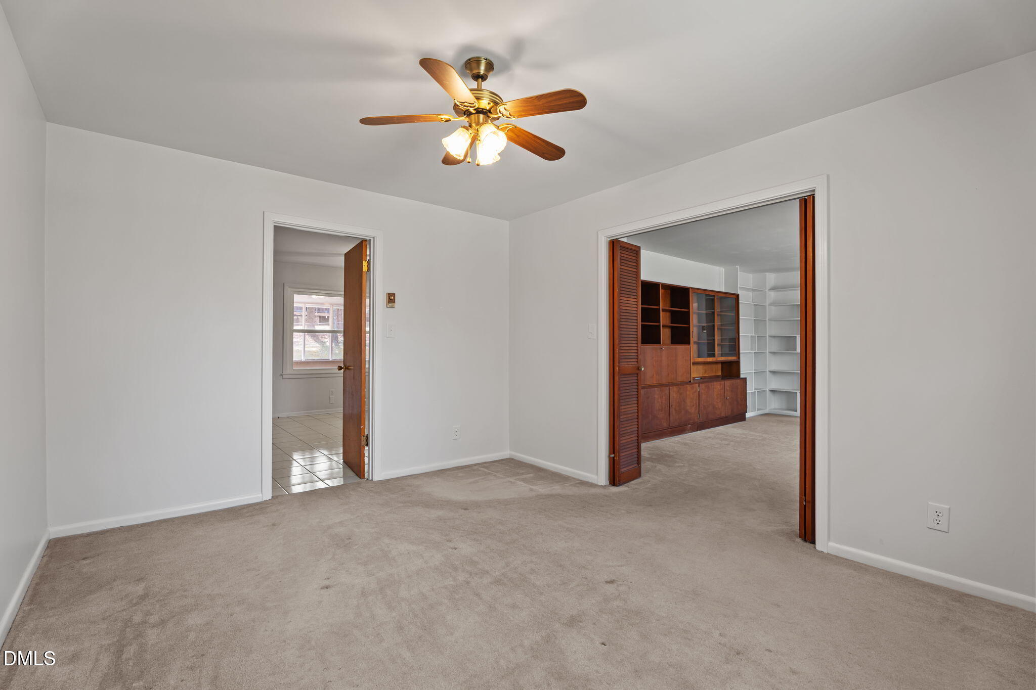 6409 Arrington Road Raleigh, NC 27607 - Photo 9 of 39 an empty room and chandelier fan