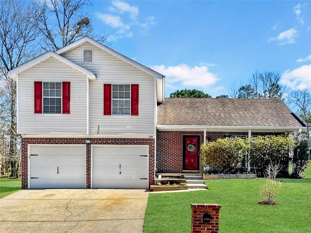 2199 Ramblewood Circle Decatur, GA 30035 - Photo 1 of 1 a front view of a house with a yard