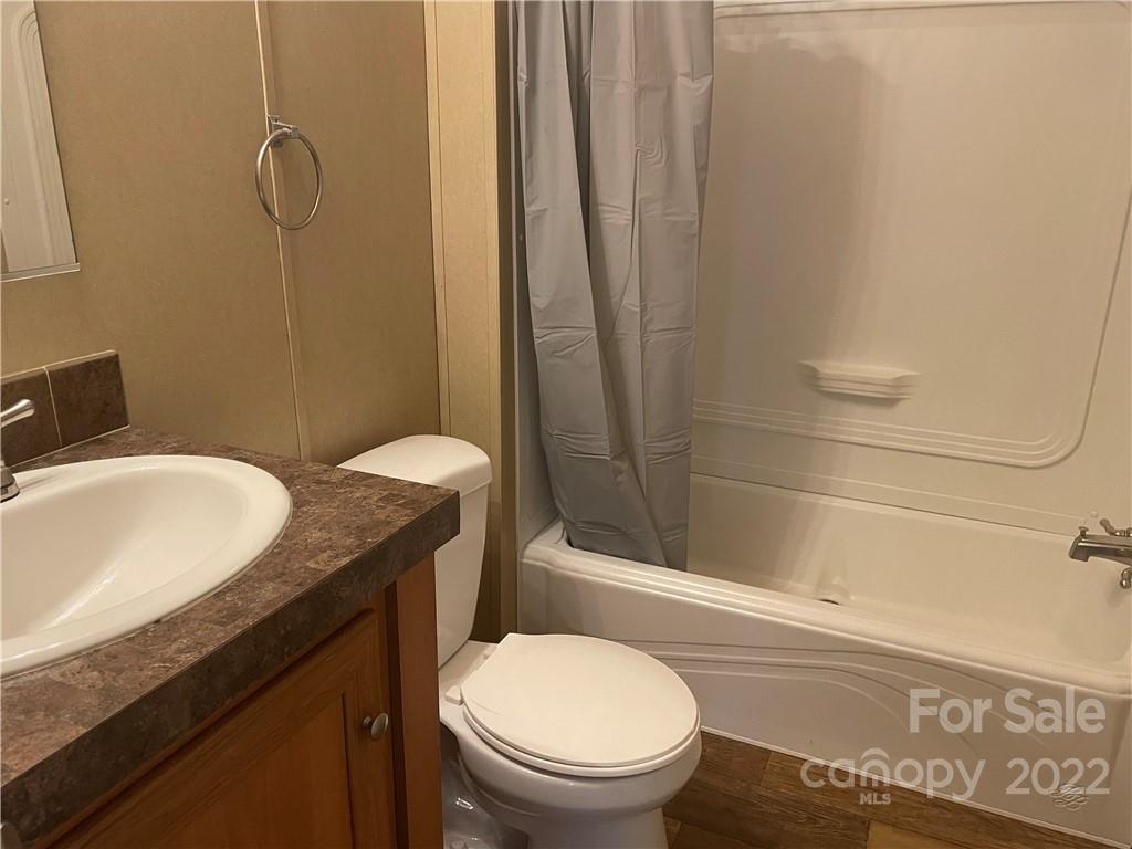 2542 Center Road Chester, SC 29706 - Photo 14 of 17 a bathroom with a granite countertop sink toilet and shower