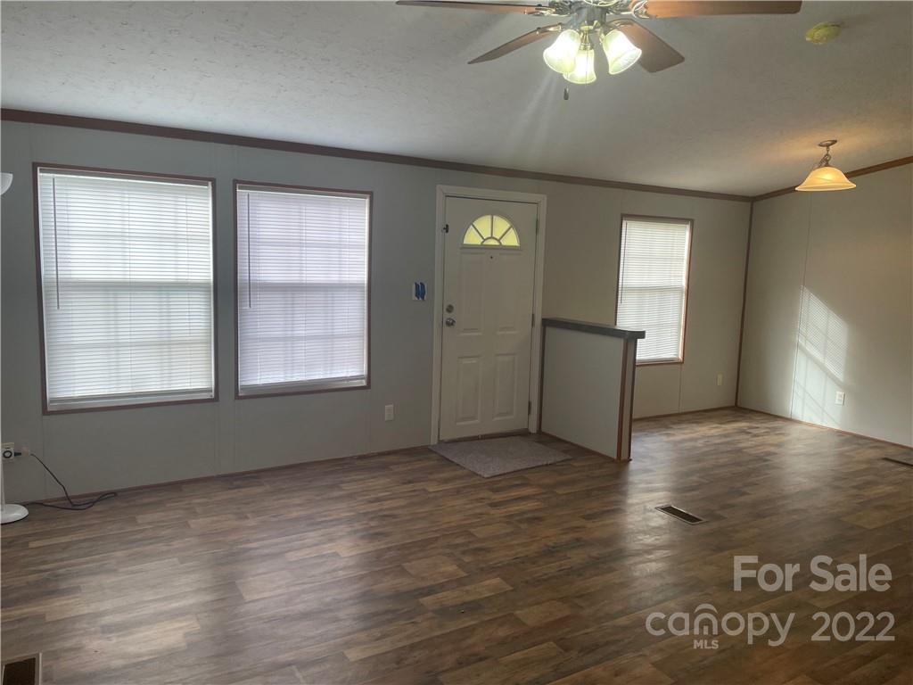 2542 Center Road Chester, SC 29706 - Photo 4 of 17 a view of an empty room with window and wooden floor