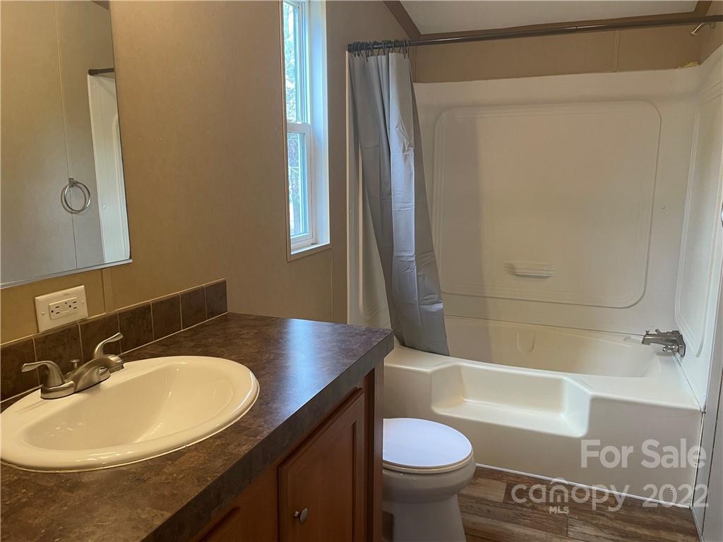 2542 Center Road Chester, SC 29706 - Photo 8 of 17 a bathroom with a sink toilet and shower