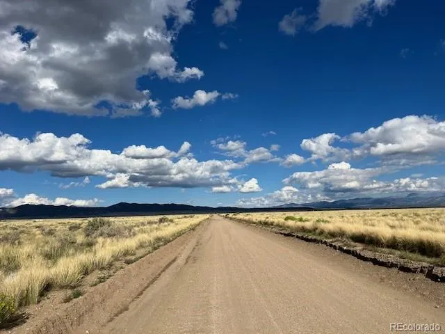a view of swimming pool and mountain in the background