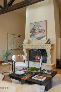 a bathroom with a toilet a sink a mirror and shower