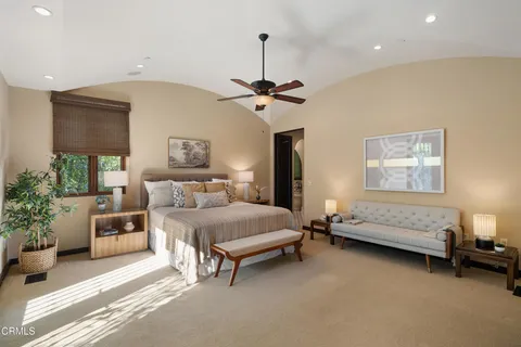 a bedroom with a bed and a lamp