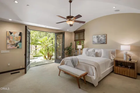a view of backyard with swimming pool and outdoor seating
